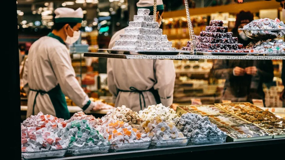 Traditional oriental sweets placed on candy shop showcase