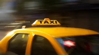 Panning Photography of Yellow Taxi and app